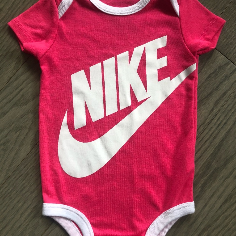 Pink Nike baby girl bodysuit